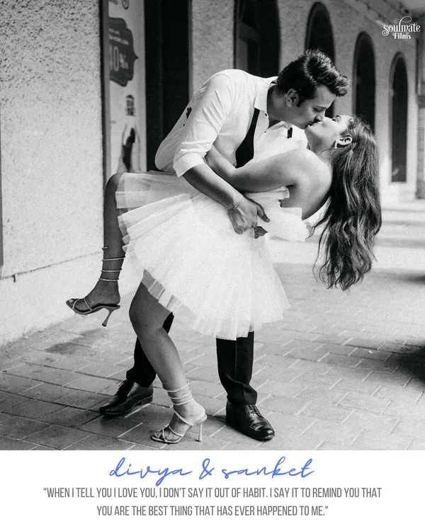 A classic Hollywood-style dip and kiss. This black and white shot, with her beautiful tulle dress and his effortless style, feels like a moment straight out of a timeless romantic movie.