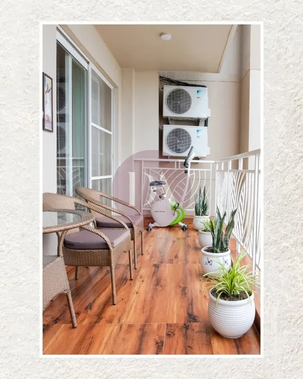 Even a compact balcony can be a peaceful retreat. We used warm wood-look flooring, comfortable seating, and a few potted plants to transform this space into a perfect spot for morning coffee or an evening workout.