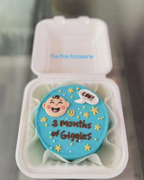 A cute bento cake celebrating "3 Months of Giggles." These mini cakes are perfect for marking smaller milestones.