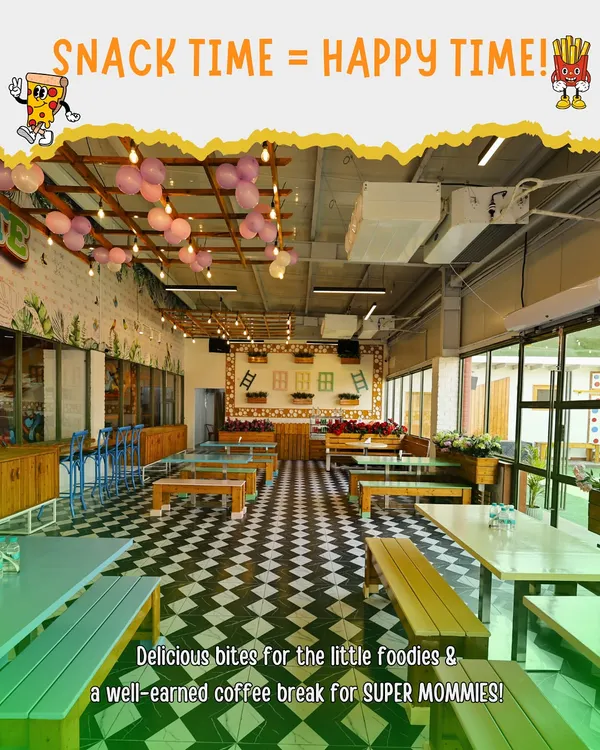 A look inside our spacious and vibrant cafe area. With plenty of seating, it's the perfect spot for parents to relax with a coffee while the kids play, and where everyone gathers for delicious party food.