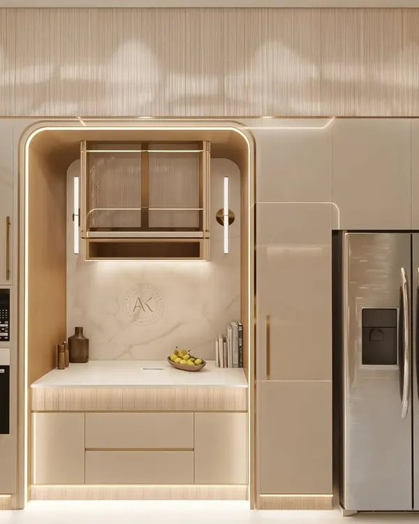 This kitchen is designed to be the heart of the home, balancing understated luxury with everyday function. I focused on a palette of muted beige tones and soft, integrated lighting to highlight the clean lines and curved forms. The design features handleless drawers for a seamless look, fluted glass shutters paired with brushed brass for a touch of texture, and a striking marble-look backsplash that serves as a piece of art.