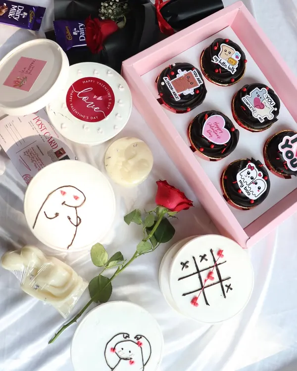 This is my Valentine's collection spread. It shows the variety you can get, from the 'Love Notes' cupcake box to the individual tub cakes with cute meme designs.