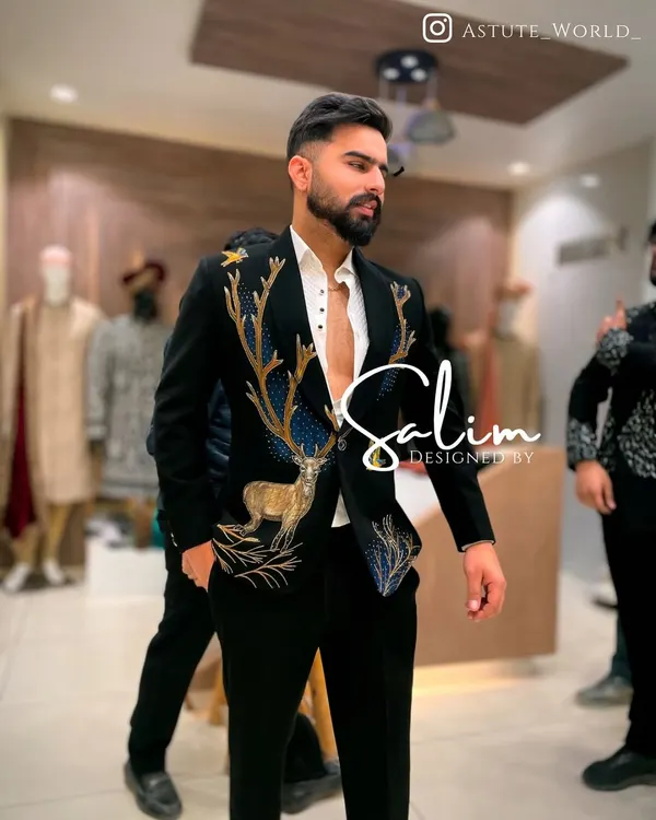 This custom-embroidered black velvet blazer with a majestic deer motif is a perfect example of my wearable art. It's designed for the man who wants his formal wear to tell a story, ideal for a standout appearance at a wedding reception or gala.