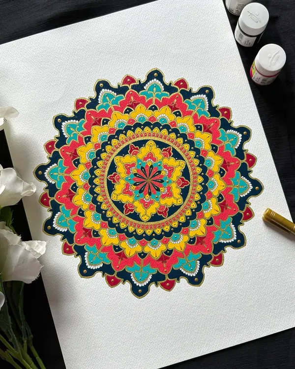 A close-up of a stunning ornate mandala. The combination of deep blues, radiant yellows, and rich reds creates a feeling of royalty and celebration. This is a style I absolutely love teaching.