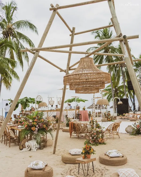 We designed this 'Rustic Tropics' celebration on the sands of Mauritius, using a massive bamboo structure and wicker lantern as the central design element.