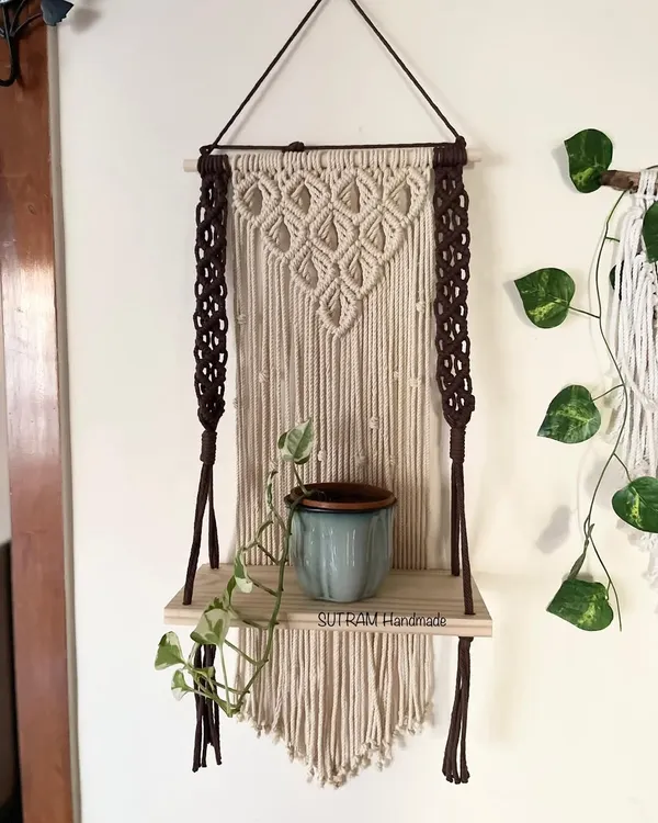 I love making pieces that are beautiful and useful! This macrame floating shelf is perfect for holding a small plant, some books, or your favorite little treasures. The dark brown and natural off-white cotton gives it a lovely contrast.
