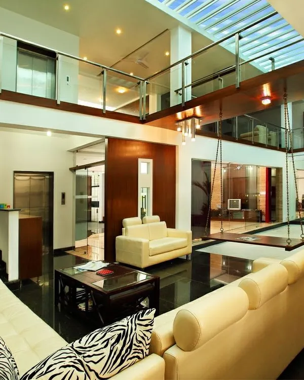 This residence is a contemporary interpretation of a traditional courtyard home. The central, sky-lit space acts as the heart of the house, with all rooms organized around it to maximize light and maintain a constant visual connection.