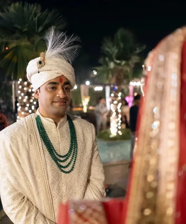 The groom's emotional and adoring gaze as he sees his bride for the first time. This is a powerful, once-in-a-lifetime moment.