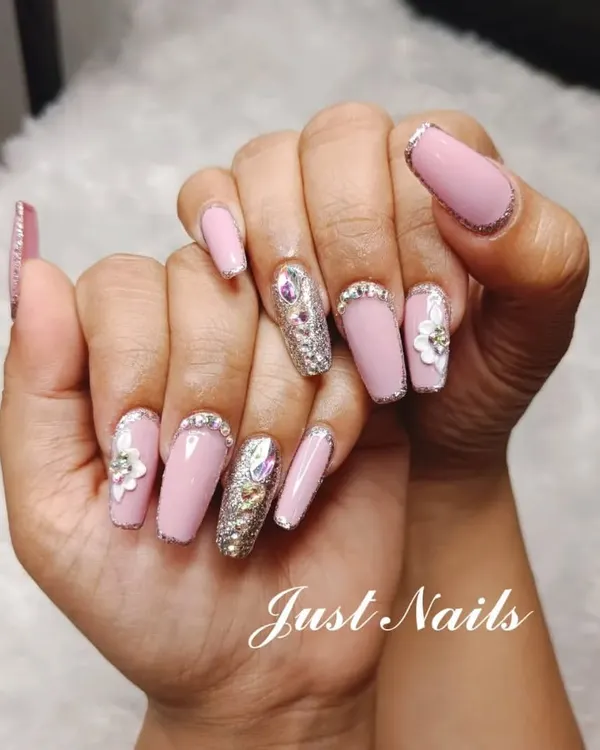 A truly glamorous set featuring pink coffin nails with silver glitter accents, 3D flowers, and a full-coverage silver glitter nail with a large crystal centerpiece. This is a statement look for a bride who wants maximum sparkle.