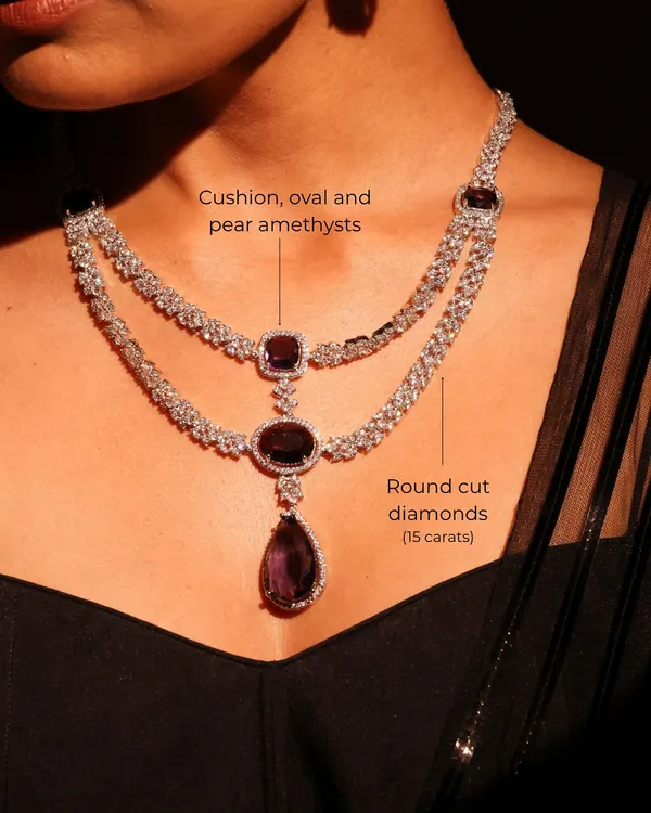 This bridal masterpiece features a symphony of cushion, oval, and pear-shaped amethysts, crowned with 15 carats of brilliant round-cut diamonds. It is designed to shimmer with a regal grace that feels both grand and personal.