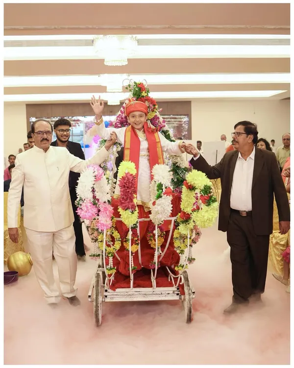 The grand entrance for a milestone birthday. I make sure to capture the big, show-stopping moments like this one, where Shreeyan arrives in a beautifully decorated cart, surrounded by smoke effects and cheering family. It’s a memory that truly deserves a spectacular photograph.