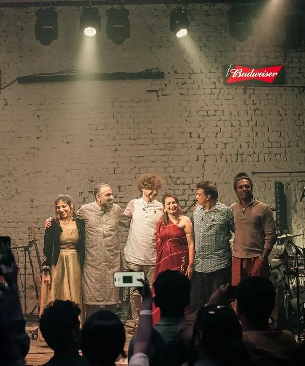 The whole band on stage at the end of a fantastic show in Mumbai. This picture captures the camaraderie and joy we share after pouring our hearts out for the audience. We are a family.