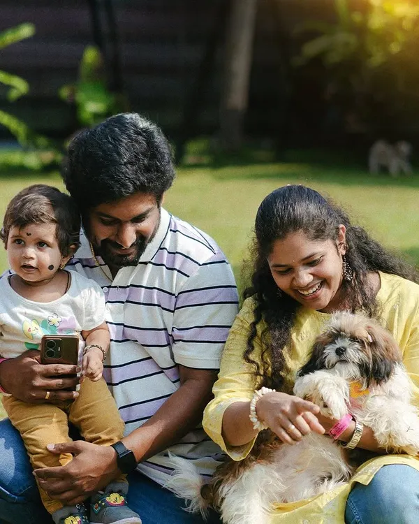 A happy family with their child and pet. We're a place where the whole family, including the little ones, can have fun.