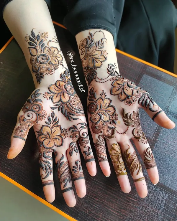 A beautiful floral design I created for Aayesha. The large flowers on the palm are connected with delicate vines, creating a very graceful look.