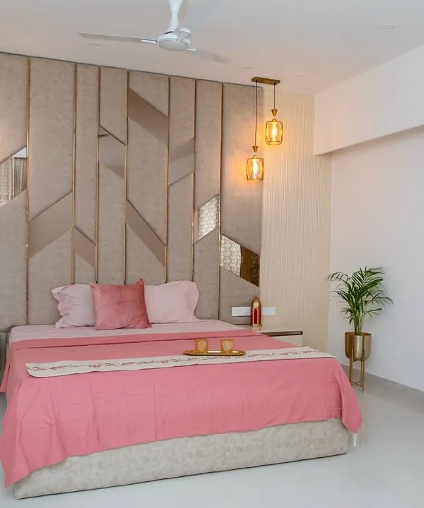 This bedroom was inspired by the idea of a serene haven. I used gentle blush tones, rich textures, and subtle metallic hints to create a sense of calm luxury. The geometric headboard serves as a stunning focal point, balanced by warm pendant lighting.