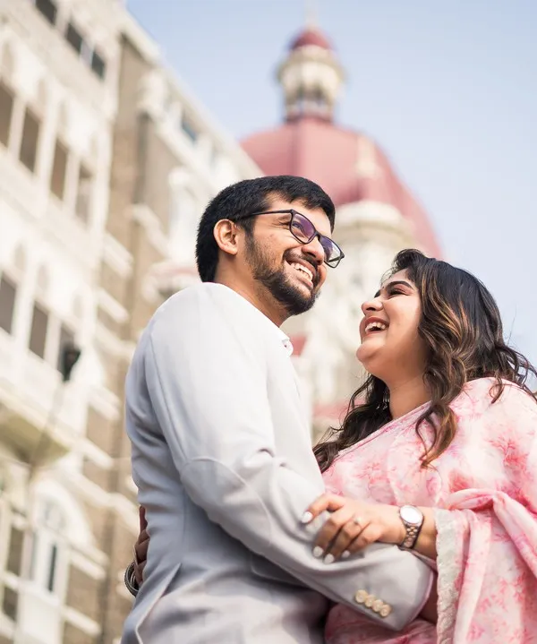Laughter with the iconic Taj Mahal Palace hotel as the backdrop. We love capturing the joy of a Mumbai pre-wedding shoot.