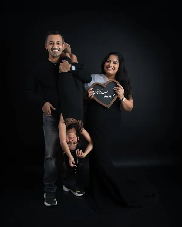 A fun and playful family portrait. I love capturing the unique personality of each family, and this shot with their daughter upside down is full of laughter and joy.