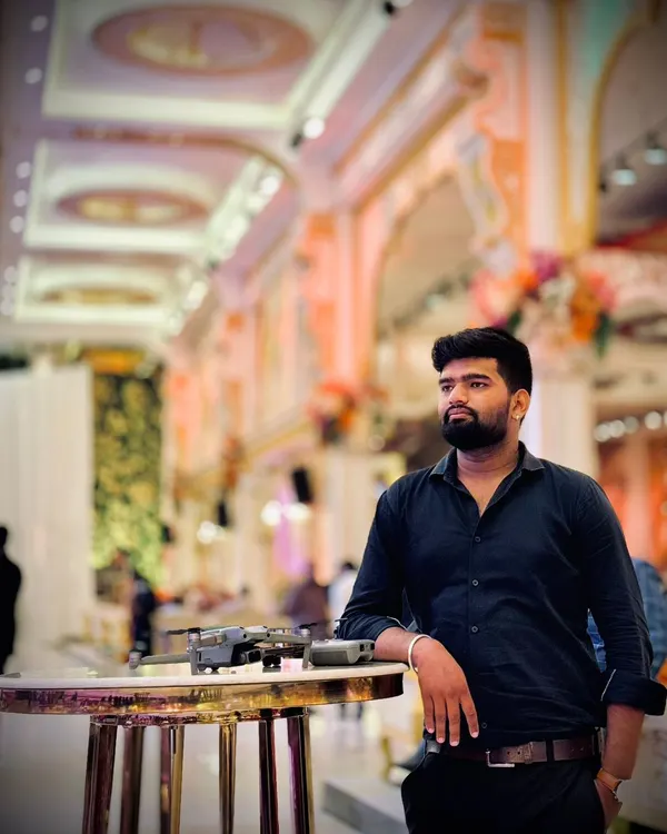 Me with my drone at a wedding venue. As a dedicated drone pilot, I am always focused on finding the next great shot to make your memories count.