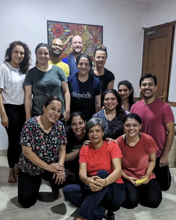 A happy group photo celebrating International Yoga Day. This is my yoga community, transformed by the practice and the connection we share.