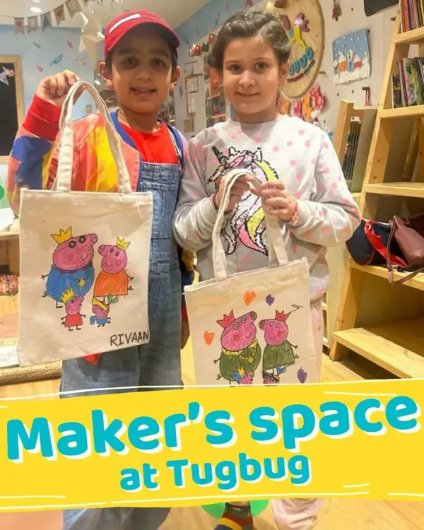 Welcome to the Maker's Space! These two are so proud of the tote bags they designed and painted themselves. It's a fun, practical craft that lets their creativity shine.