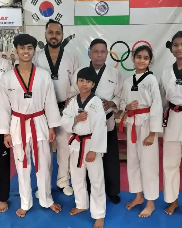 Our newly promoted black belts and red belts after a rigorous examination. This is a huge step in their Taekwondo journey.