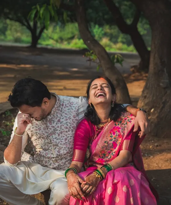 This is pure, uninhibited joy. A couple sharing a huge laugh during their portrait session. These are the authentic, unposed moments that are our absolute favorite to capture.