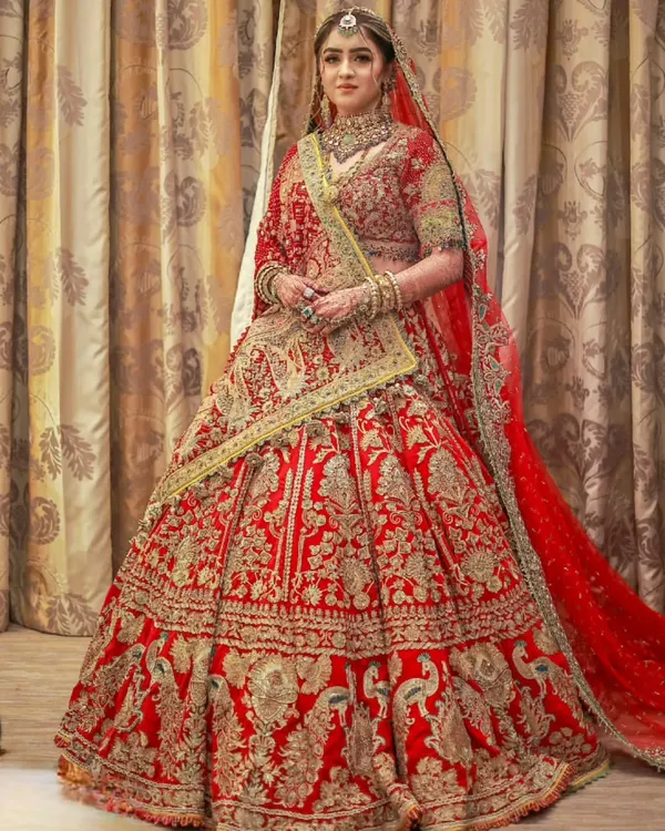 A full view of this magnificent Rimple and Harpreet bridal lehenga. My focus was on the double dupatta draping, creating a royal silhouette that was both traditional and stunningly beautiful for her Nikkah.