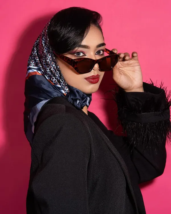 A close-up from my editorial shoot published in Opium Red Magazine. This look, inspired by 80s glamour, features a custom black blazer with feather-trimmed sleeves.