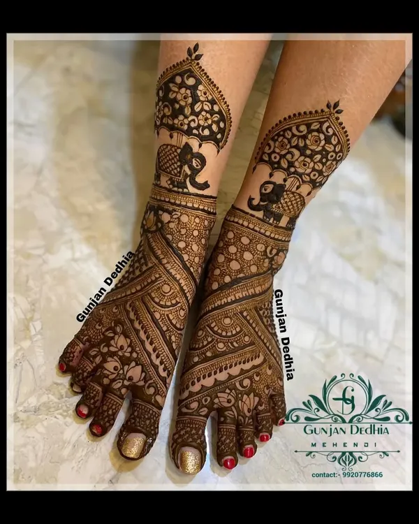 A beautiful bridal feet design featuring baby elephants under a decorative umbrella. The intricate patterns cover the entire foot for a complete and traditional look.