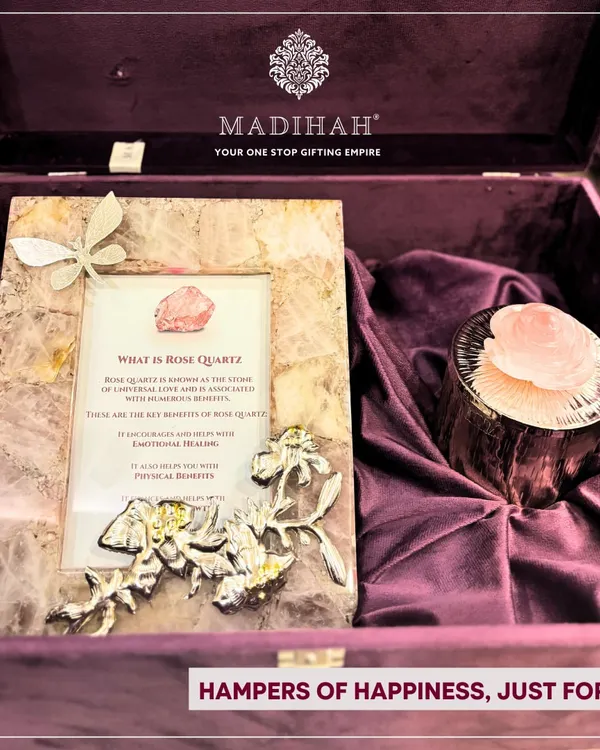 My Rose Quartz Aura Hampers are designed to share positivity. This hamper features a photo frame and candle holder crafted from authentic rose quartz, the stone of universal love, presented in a deep purple velvet box.