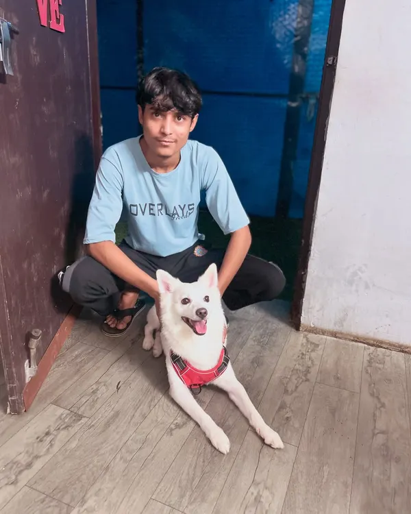 A happy moment with Bunni and one of our team members during his birthday celebration. Our staff loves every dog like their own.