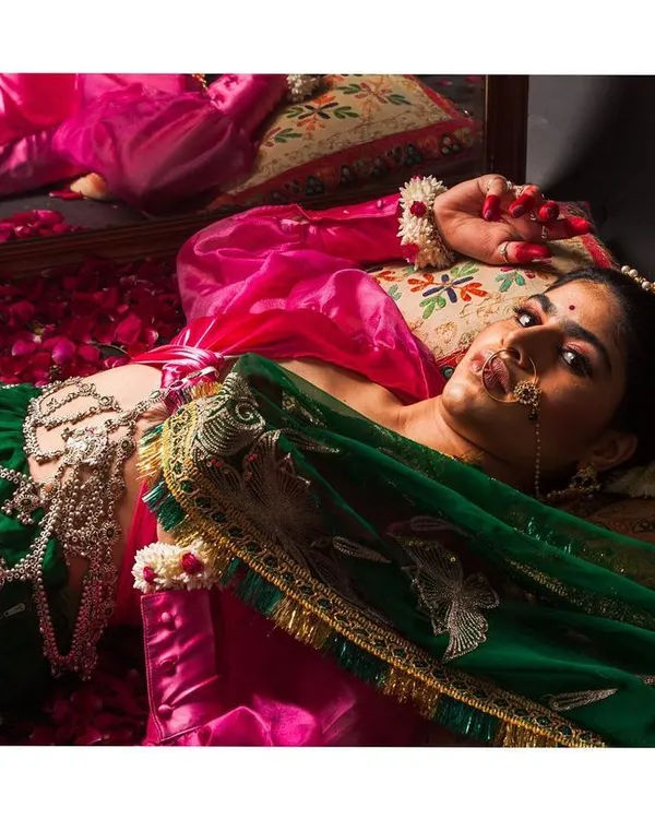 This frame is inspired by the rich history of Mughal and British influence on Indian fashion. I used dramatic lighting to highlight the luxurious textures of the green and pink fabrics and the intricate details of the jewellery, creating a portrait that feels both timeless and opulent.