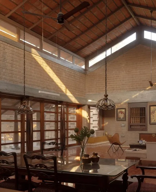 Our Kaattu Veedu Guesthouse in Hosur was designed to be in dialogue with its surroundings. The structure rises from the earth, with high ceilings and large windows that frame the tranquil landscape.