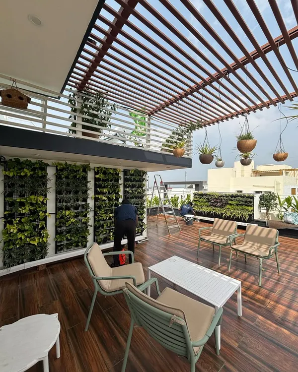 A sprawling terrace garden we designed, featuring multiple vertical gardens, comfortable seating, and hanging planters. This space is a perfect example of how a rooftop can be transformed into a lush, functional, and beautiful retreat.