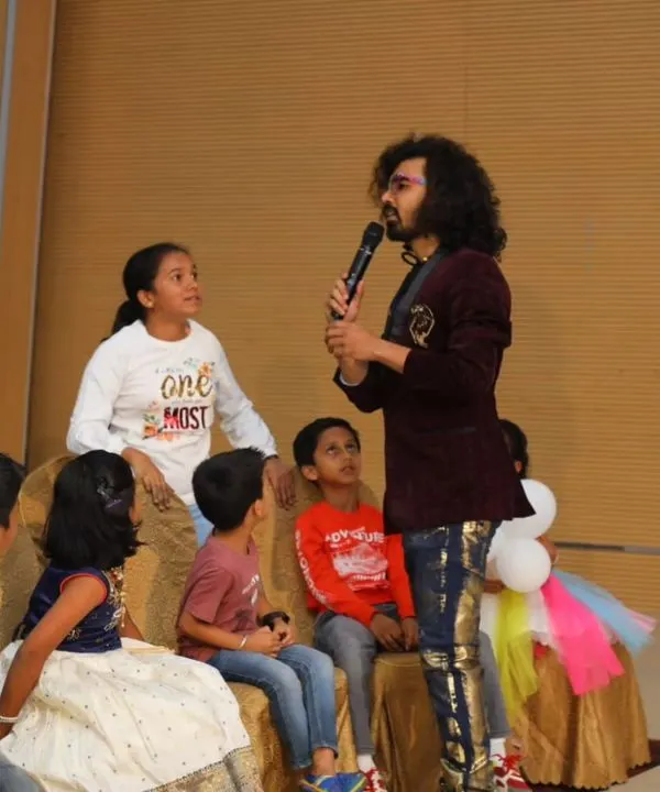 A group of kids gathered around, completely captivated by the magic. I love these intimate moments where I can perform illusions up close.