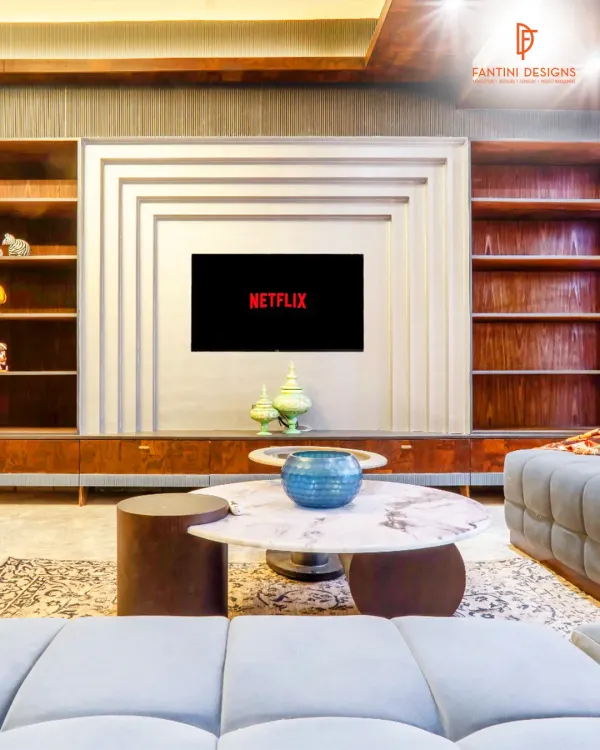 This entertainment unit is the centerpiece of the living room. I designed it with a unique geometric pattern and integrated shelving, blending rich wood with a modern aesthetic.