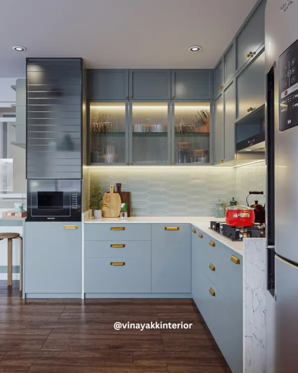 A modern kitchen should be as beautiful as it is functional. For this project, I chose calming powder-blue cabinets with sleek gold handles for a contemporary look. Features like fluted glass shutters and under-cabinet lighting add both style and practicality.