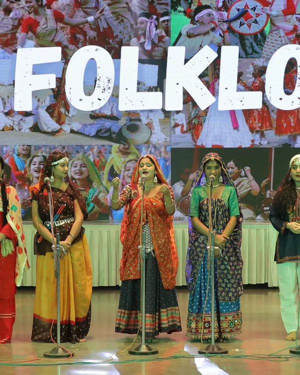 Performing a Rajasthani folk song with my group, dressed in traditional attire for a G20 event. I can organize and perform folk music for culturally themed events.
