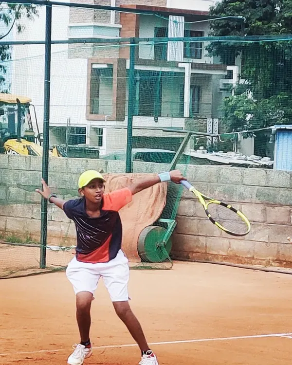 A young, dedicated player executes a powerful forehand during a training session. My coaching focuses on developing strong fundamentals and proper technique from an early age.
