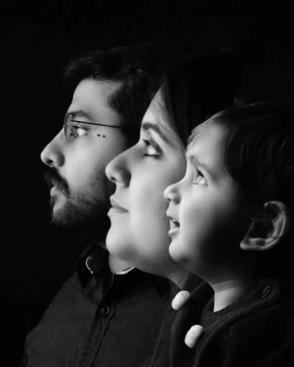 A creative black and white profile portrait showing three generations or family members in a single artistic composition. This is a powerful way to represent your family's legacy.