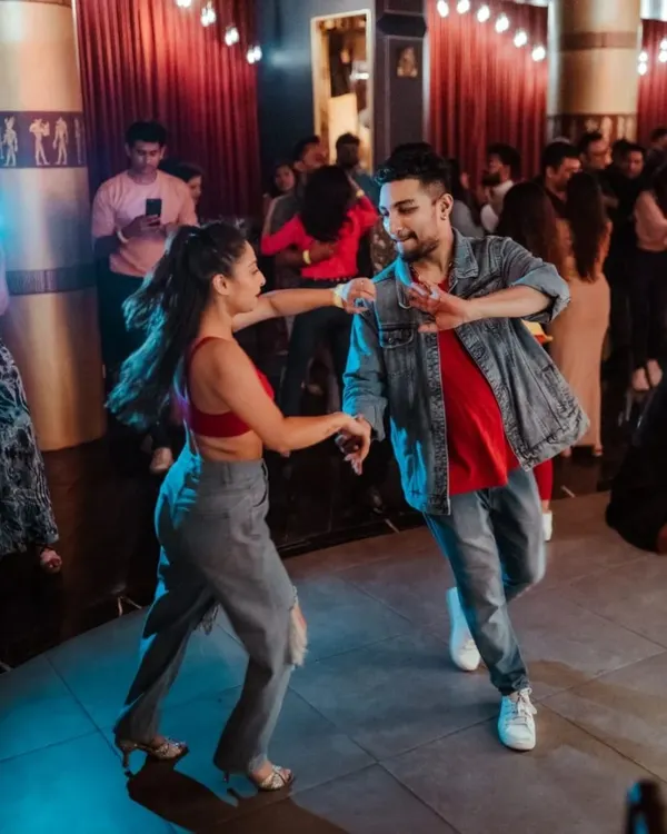 Dancing through the night at a social. We love the energy of a crowded dance floor and connecting with fellow dancers.