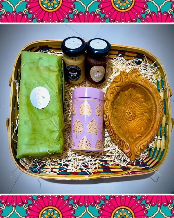 My special Diwali hamper, featuring almond and walnut laddus, nut butters, and millet flakes chivda, complete with a traditional diya. It's the perfect way to share health and happiness.