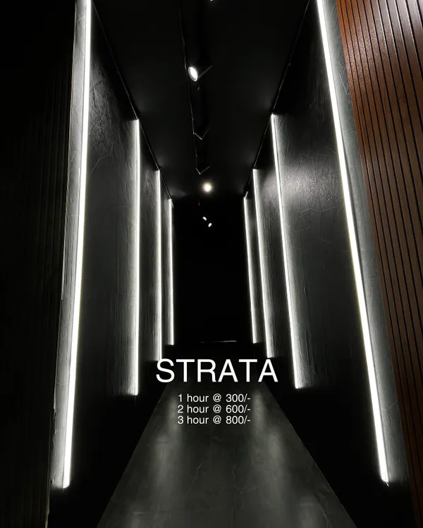 This is the 'Strata' booth. A dark, narrow hallway lined with vertical white light panels that create a futuristic, high-contrast look. It's a unique, ready-made set for your next music video or dance reel, with rental rates listed.