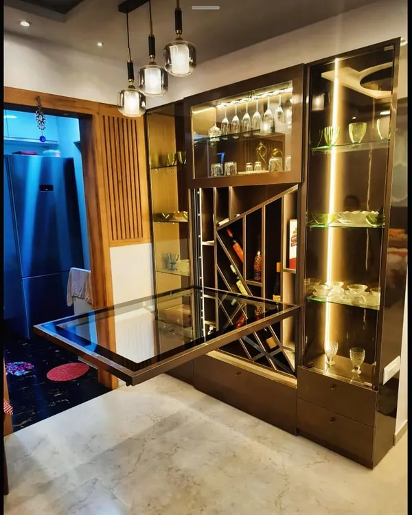 This unit serves as both a stylish bar with wine storage and a fold-out dining table. It's the perfect solution for entertaining in a compact apartment.