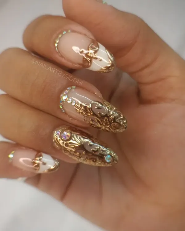 A full hand view of my signature 3D gold filigree nails. The raised, intricate scrollwork is sculpted by hand on each nail, creating a stunning, high-fashion look.