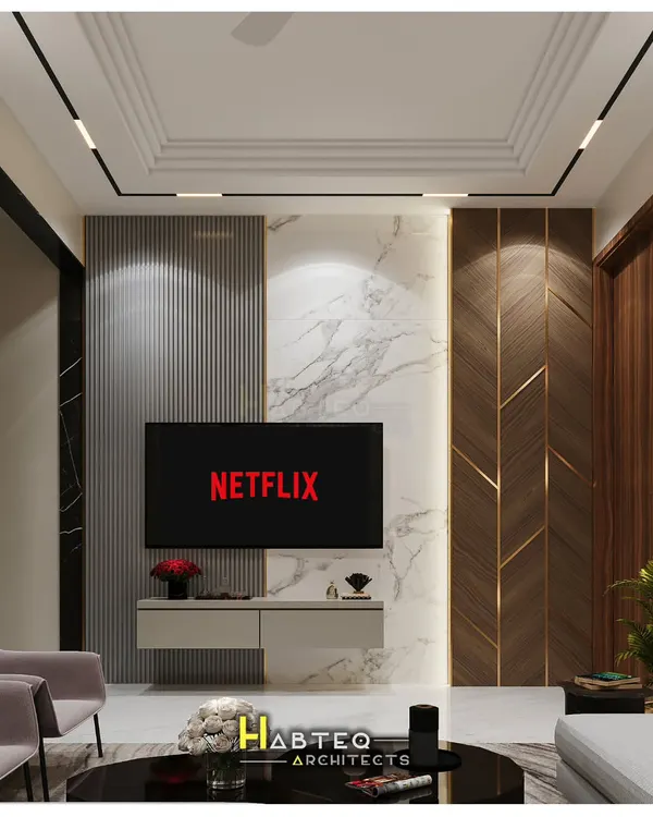 A 3D render of a TV unit wall, combining vertical WPC louvers, white marble, and wood paneling with brass inlays. This design for a 2BHK flat shows how to create a sophisticated entertainment zone.