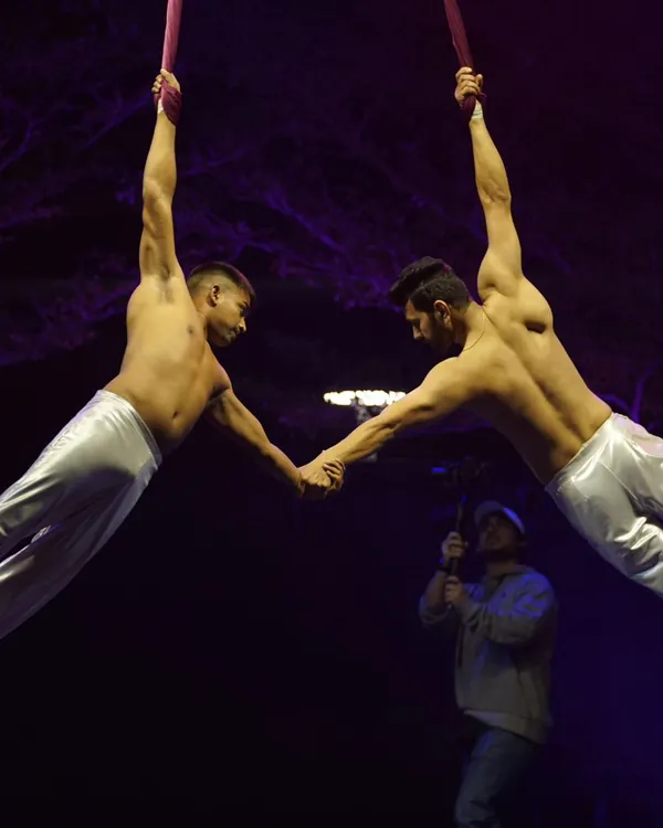 A moment of connection during a duo aerial silks performance. These acts are built on complete trust and communication, allowing us to create powerful shapes and movements together in the air.