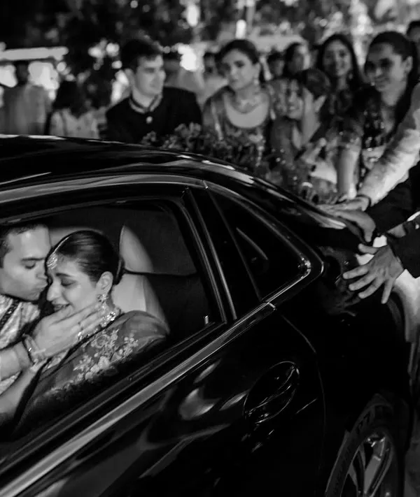 This is it. The reason we document weddings. This moment during the vidaai, as the groom comforts his bride in the car, with her father looking on, is a universe of emotions. It’s about letting go and holding on, all at once. We choose to shoot these powerful moments in black and white to make them timeless.