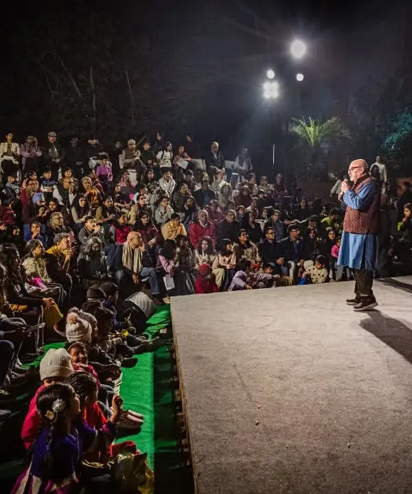 Our festival director addresses a packed house at the amphitheater. We are passionate about creating a welcoming space where the community can come together to celebrate the art of puppetry.