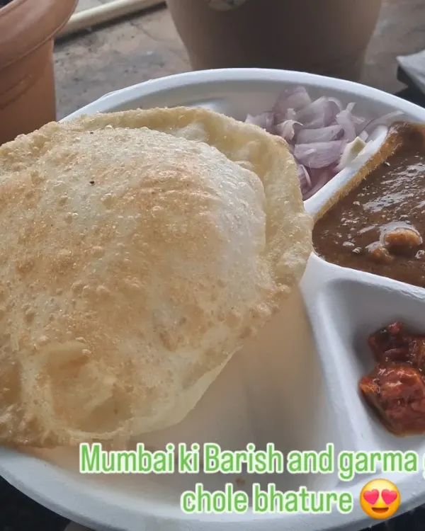 Mumbai ki Barish and garma garam chole bhature is a perfect combination. This is from our live counter at a corporate event, serving up fresh and fluffy bhature with spicy chole.